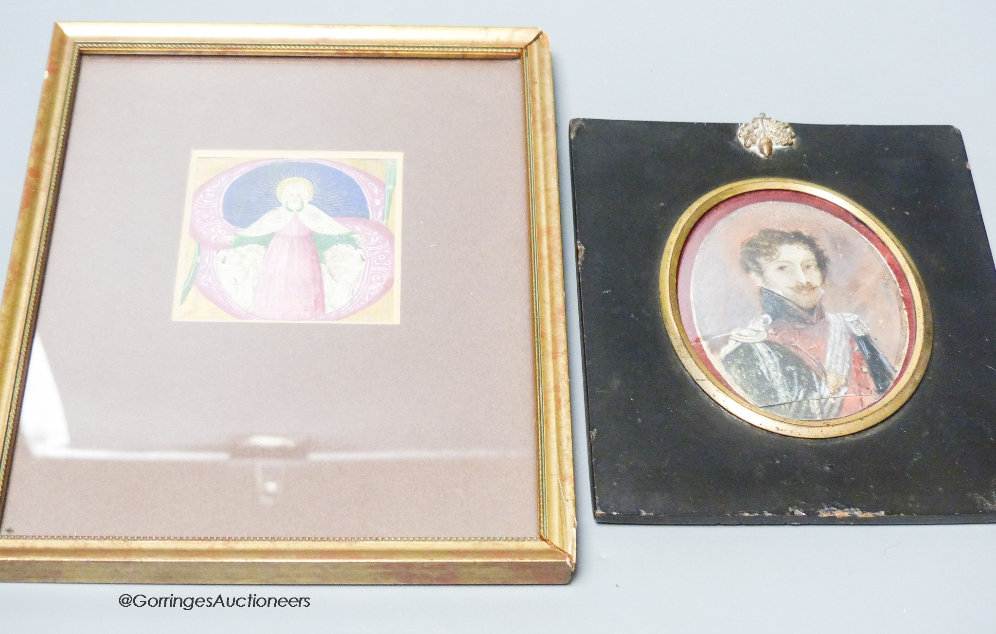 A small framed and glazed illuminated manuscript extract together with an over-painted print of a duckling (2)